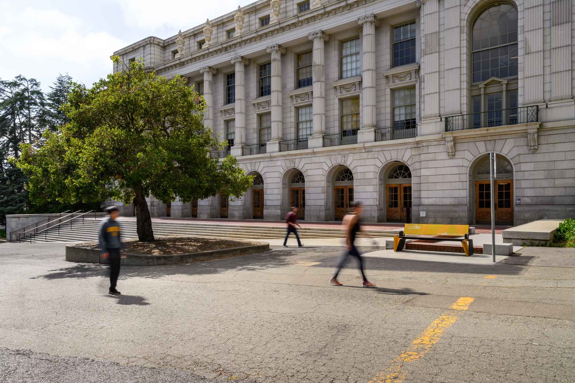 Wide view of a UC Berkeley Loop bench located on the south side of Wheeler Hall Auditorium.